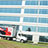 Honda advertising trailer driving by Honda Headquarters in California