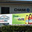 Advertising trucks for Northgate Market driving by Chase bank